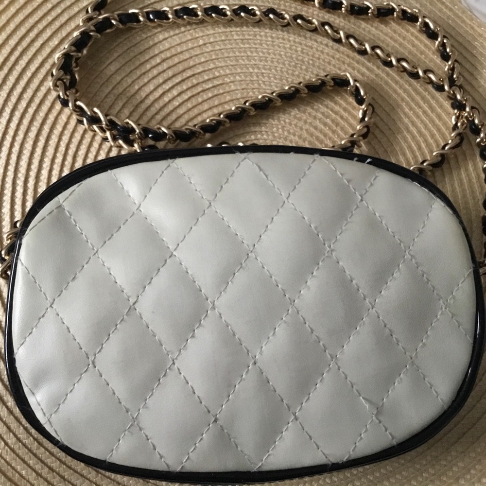 Paris Styled White and black patent quilted shoulder bag with chain link strap.